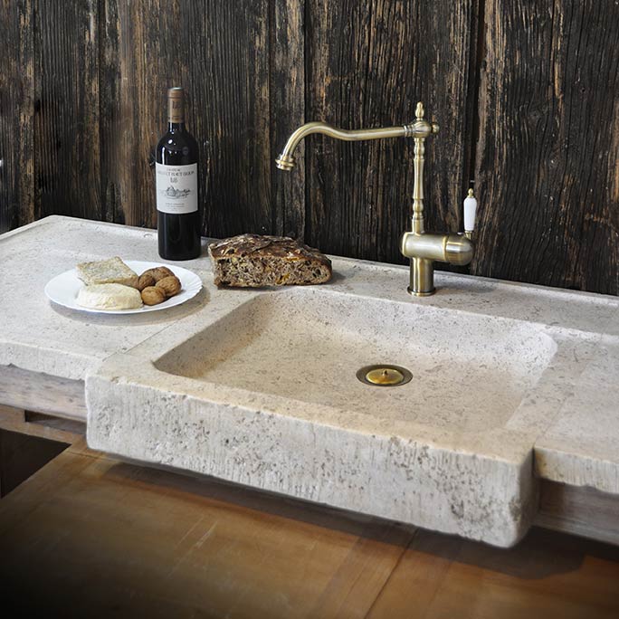 large kitchen sink in natural stone with two side drainers