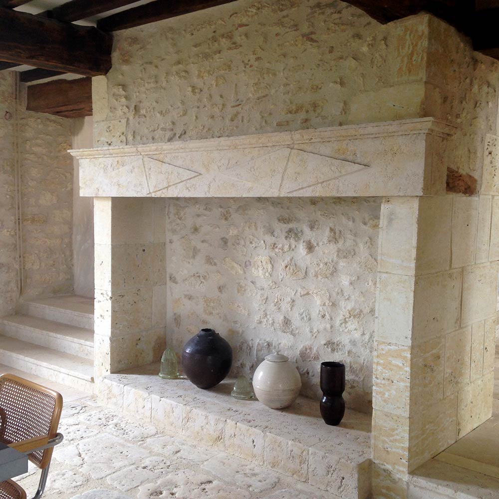 country fireplace with a stone lintel replacing the old wooden one
