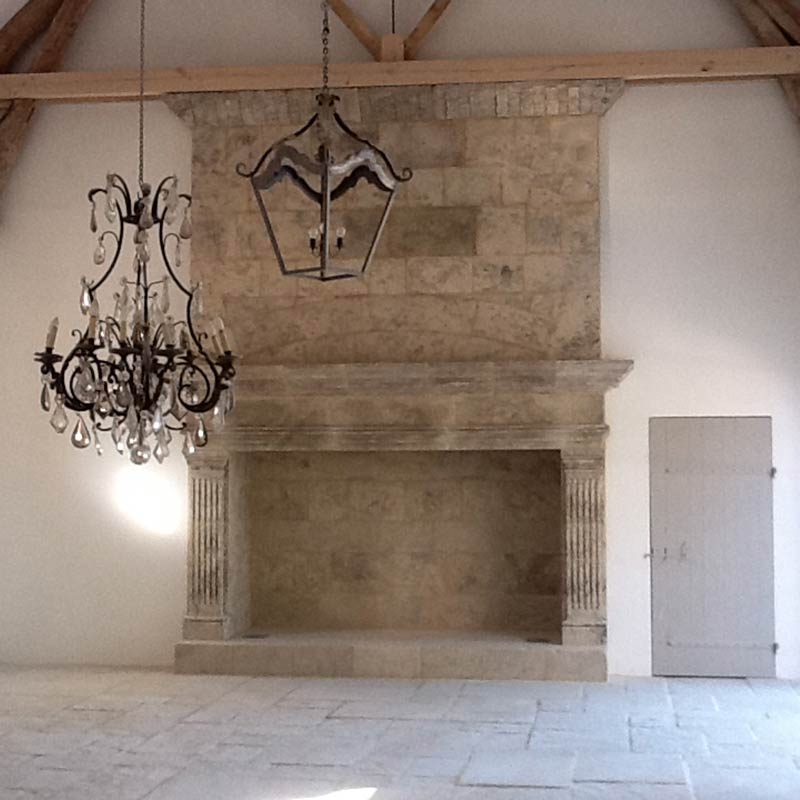 large Louis XIV style ashlar fireplace with moulded jambs and cornices