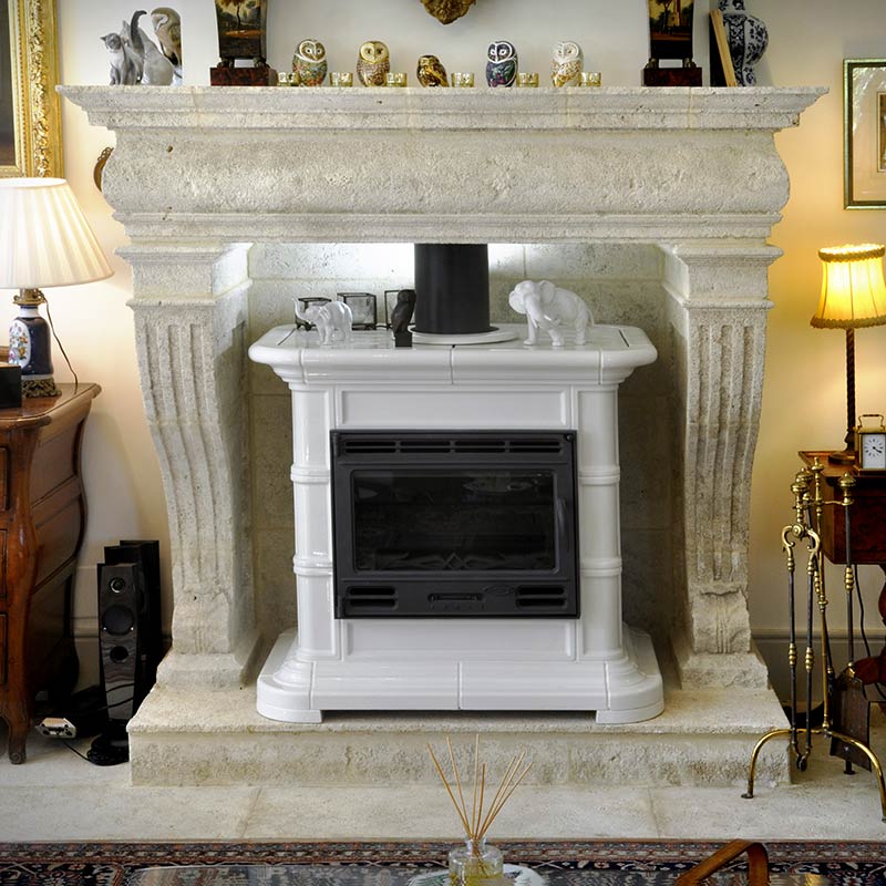 custom-made natural stone fireplace with integrated stove
