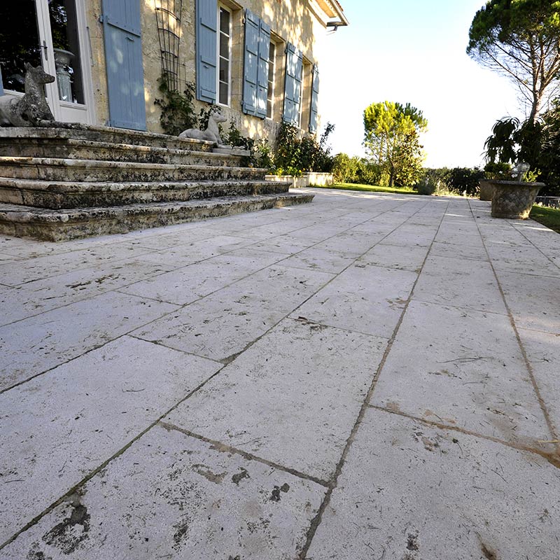 Outdoor paving in natural stone for the terrace of an old house