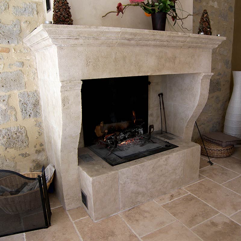 custom-made ashlar fireplace with moulded lintel