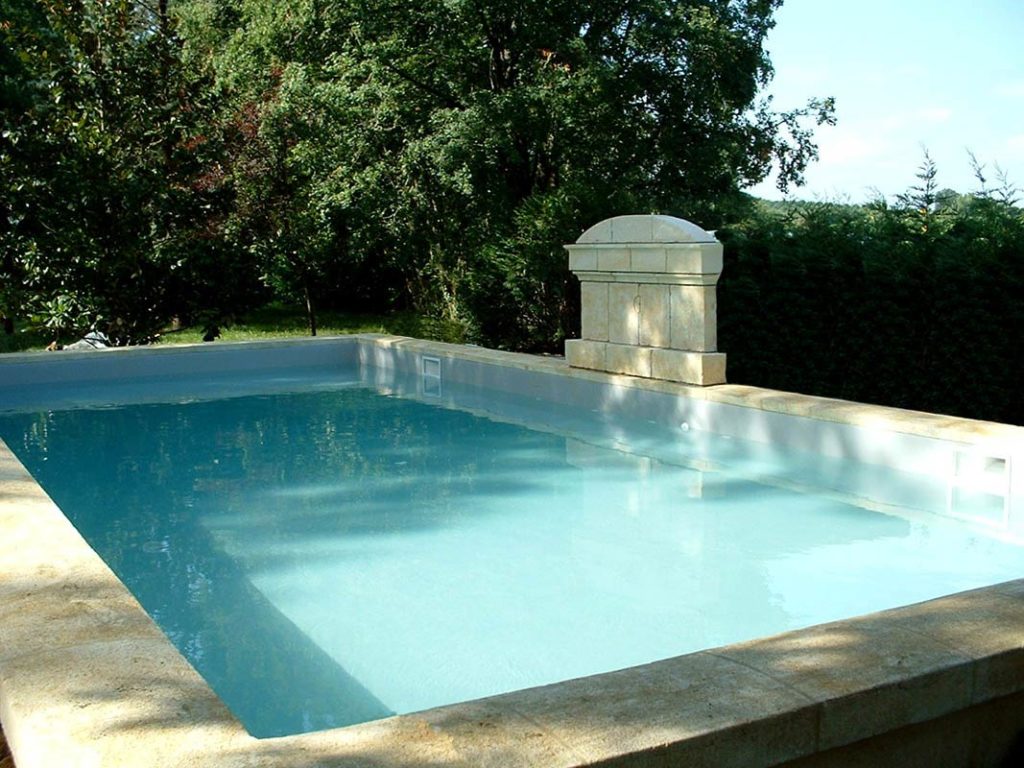 custom-made ashlar coping and pediment in the old pool style