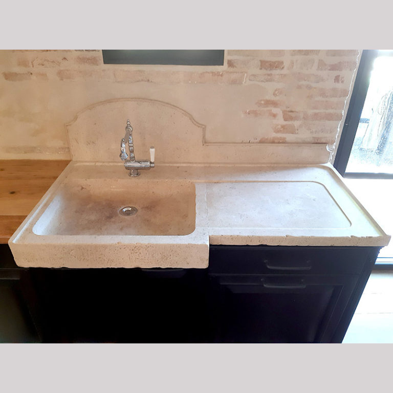 marbled natural limestone sink with a moulded credenza and a draining board, all made to measure