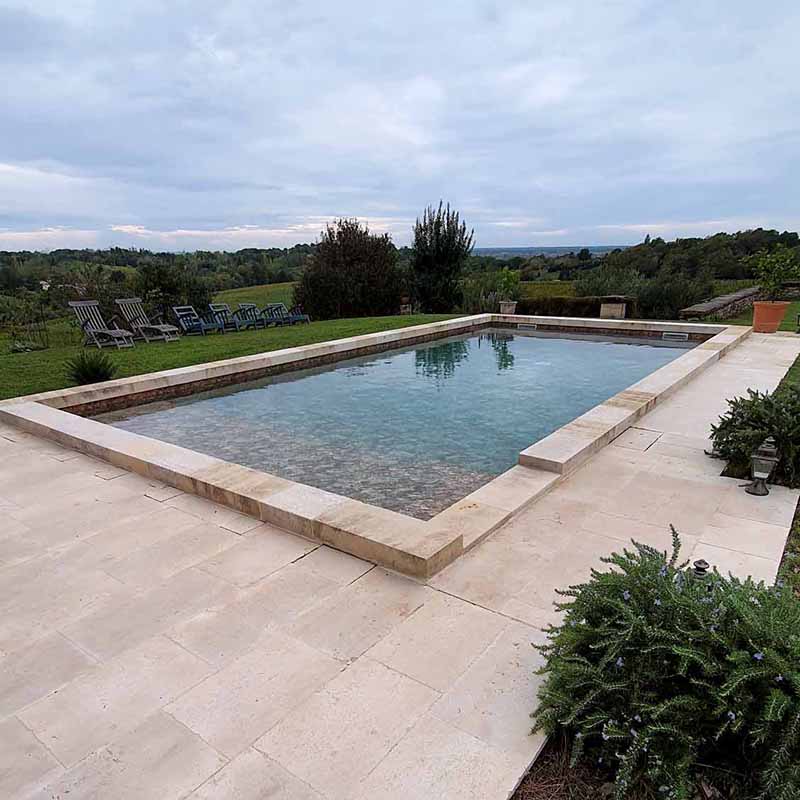 pool coping in natural limestone massive resistant thick ingelive large style old pool patina paving coordinated pool deck